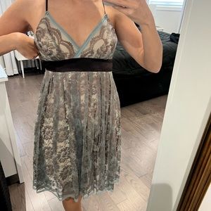 Brown lace dress which beige lining and teal lace accents